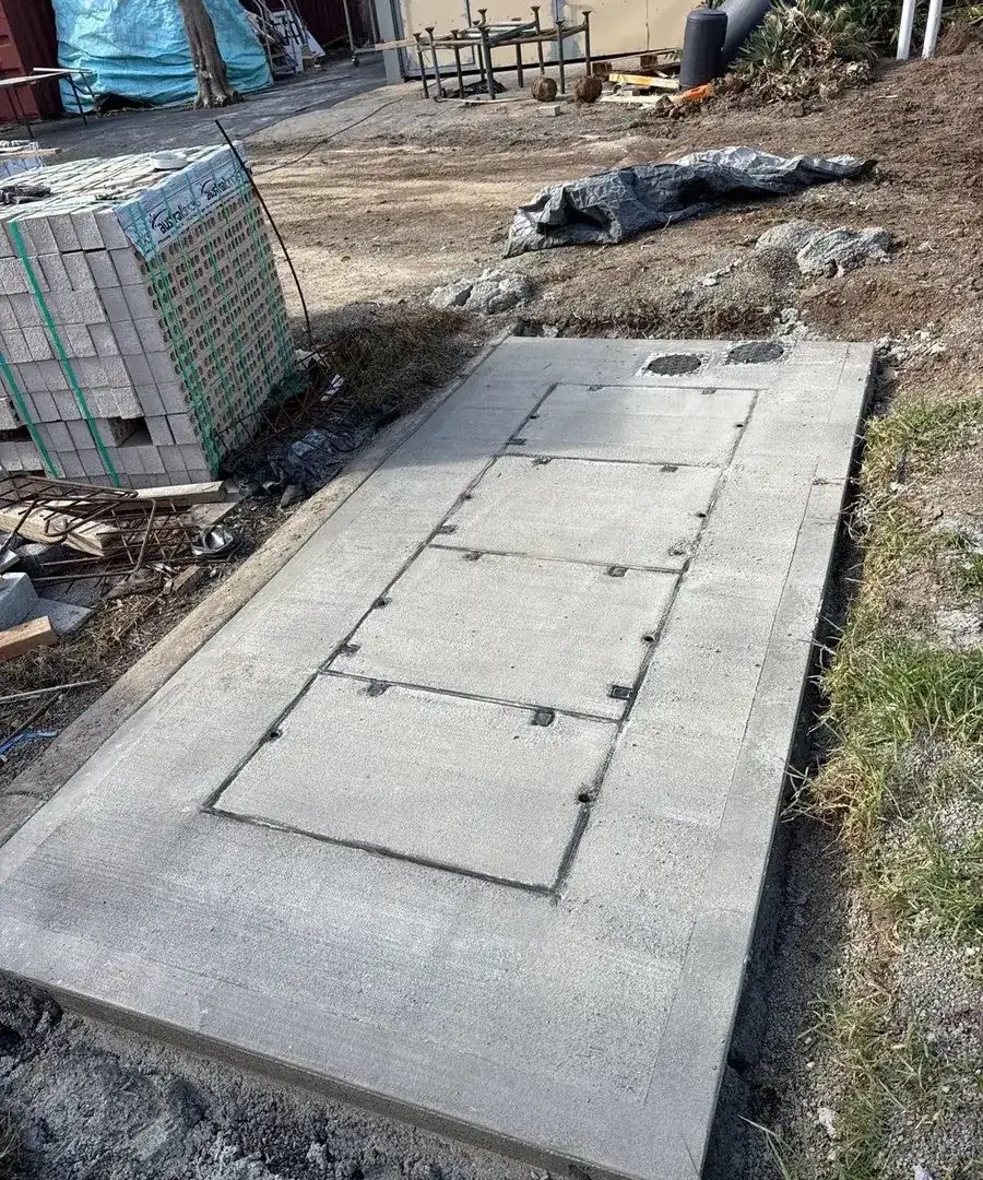 Completed concrete lid slab with access covers set flush to the finished surface